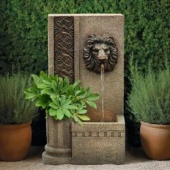 LuxenHome 25.8" H Sandstone Resin Regal Lion Head Floor Outdoor Water Fountain With Lights Brown