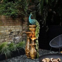 LuxenHome Peacock And Urns Resin Outdoor Fountain With LED Lights